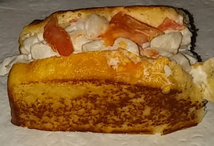 Half-eaten Grilled New England Lobster Roll