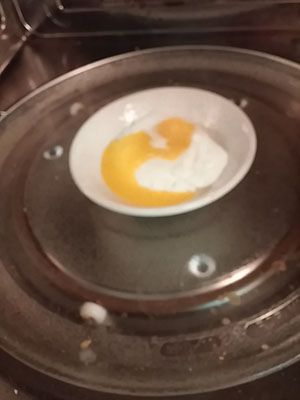 Flip egg over and return to microwave